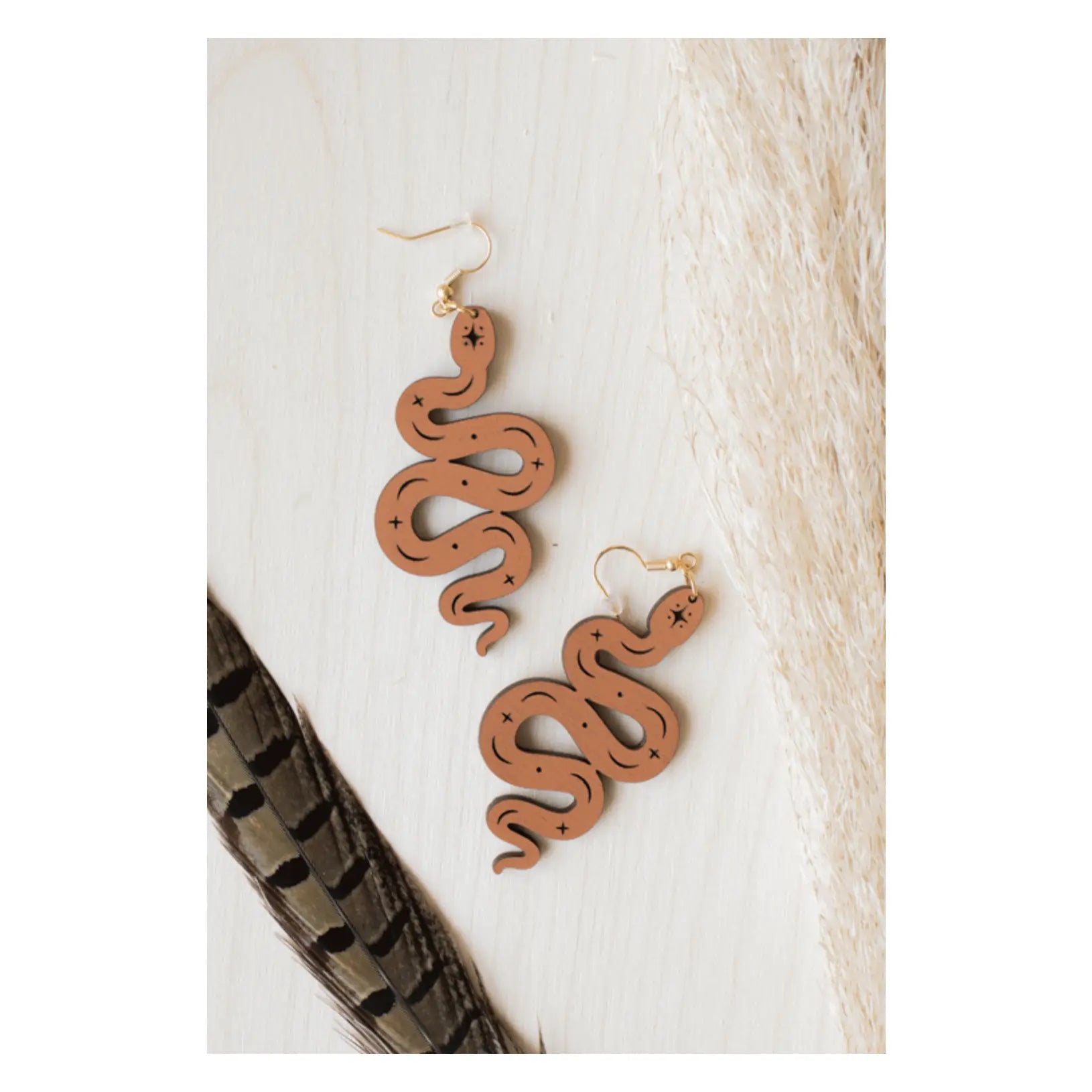 http://www.sumiye-co.com/cdn/shop/products/Earrings----Terracotta-Boho-Snake--Handmade-Jewelry-Honest-Outlaws-1673067198.png?v=1673067199