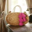 Oval Straw Tote Bag with Fuschia Pink Tassels - Sumiye Co